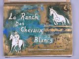 a sign that says le ranch des chevaux blanc on it
