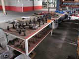 many different types of tools on a table in a warehouse