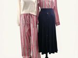 pair of women ' s clothing displayed on mannequins on a white background