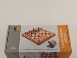 chess set in a box on a table with a white background