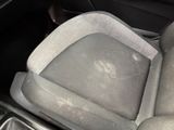 the interior of a car with the seat up and the front seats down