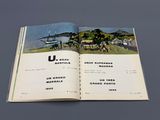 an open book with a picture of a farm scene on it