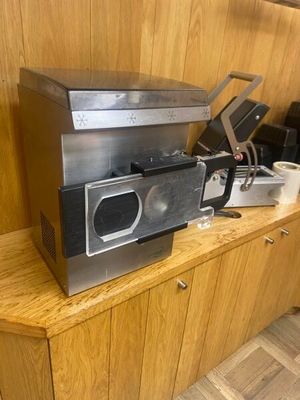 a microwave sitting on top of a wooden counter