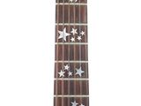 a close up of a guitar neck with stars on it