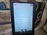 a computer screen that is sitting in front of a washing machine