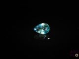 a blue diamond on a black surface