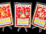 three cards that are sitting on top of each other