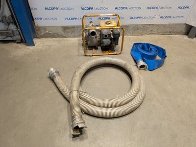 a hose and a hose on the floor next to a wall
