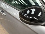 a close up of a car ' s side mirror with a reflection on it