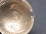 a silver cup that has been left on the table