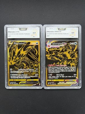 two pokemon trading cards in plastic cases on a black surface