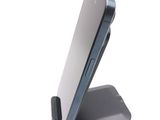 a cell phone that is sitting on top of a stand
