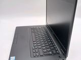 a laptop computer sitting on a table with a white background