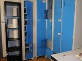 an image of a room with blue lockers and a white table