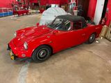 an image of a red car in a garage