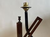 a picture of a wooden pipe holder with a metal pipe