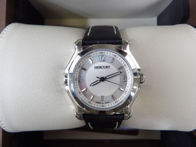 a watch that is sitting on top of a white ring