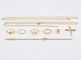 a collection of gold jewellery including rings, bracelets and rings