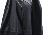 a close up of a black coat on a mannequin mannequin