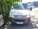a silver van parked on the side of the road