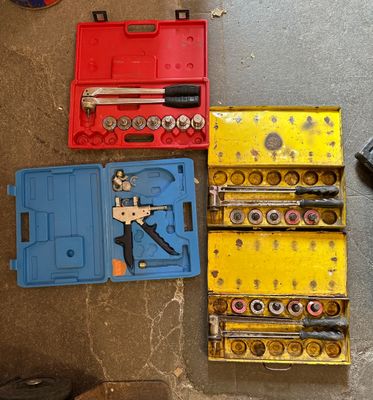 several tools are laid out on the floor next to each other