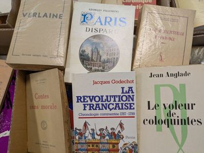 several books are stacked on top of each other on a table