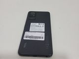 the back of a black cell phone with a barcode on it
