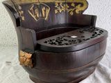 a wooden chair that is sitting on a table
