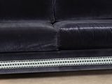 an image of a black velvet couch with silver trimming
