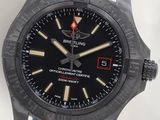 the watch is black and has a blue strap around the strap