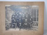 an old photo of a group of men in uniform posing for a picture