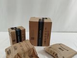 three boxes that are sitting on a white surface