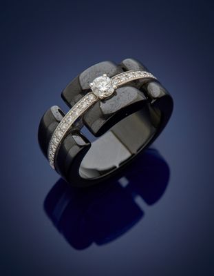 a close up of a ring with diamonds on a blue background