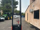 a picture of a forklift parked in a parking lot