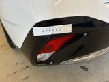 a close up of a car with a sticker on the back of it