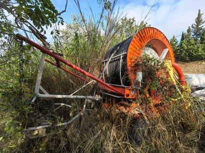 a large machine that is sitting in the middle of a field