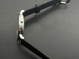 a pair of scissors that are on a black surface