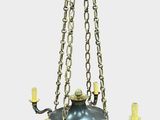 an image of a chandelier with candles hanging from it ' s ceiling