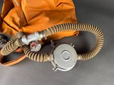 an orange bag with a gas mask attached to it