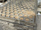 a lot of holes in the concrete on the ground