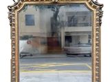 a large mirror that is sitting on the side of the road