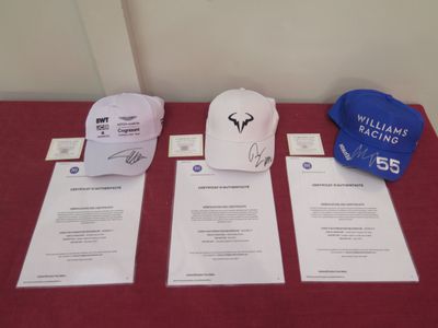 three hats on a table with a hat on top of it