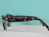a close up of a pair of sunglasses on a table
