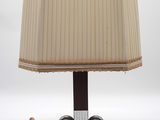 a lamp that is sitting on a table next to a cord