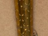 a small brass object that is on a table