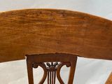 a wooden chair with a wooden seat and a wooden back