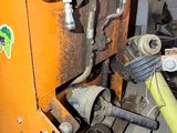 a machine that is sitting on a pallet in a garage