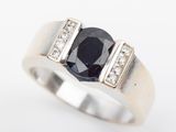 an image of a ring with a sapphire and diamonds on it