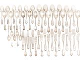 a lot of silver spoons and forks on the table