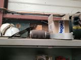 a shelf that has a bunch of tools on top of it